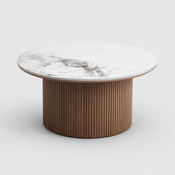 Round coffee table with marble top and ribbed brown base on a white background
